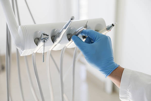 Professional Tooth Extraction technician working in Cranston, RI